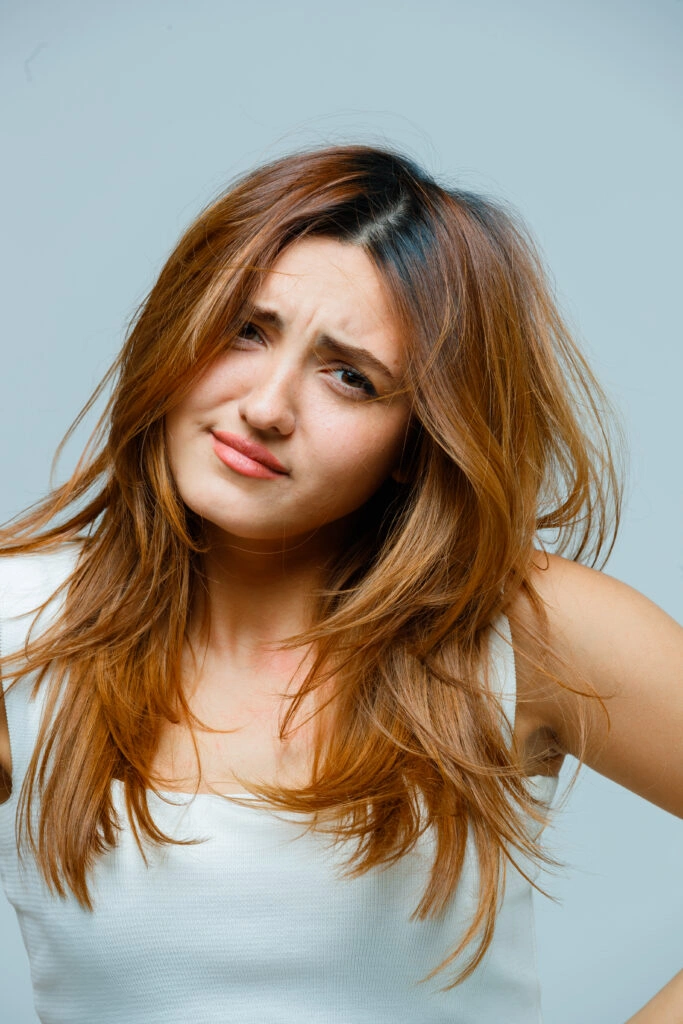 Young woman with long, wavy hair.